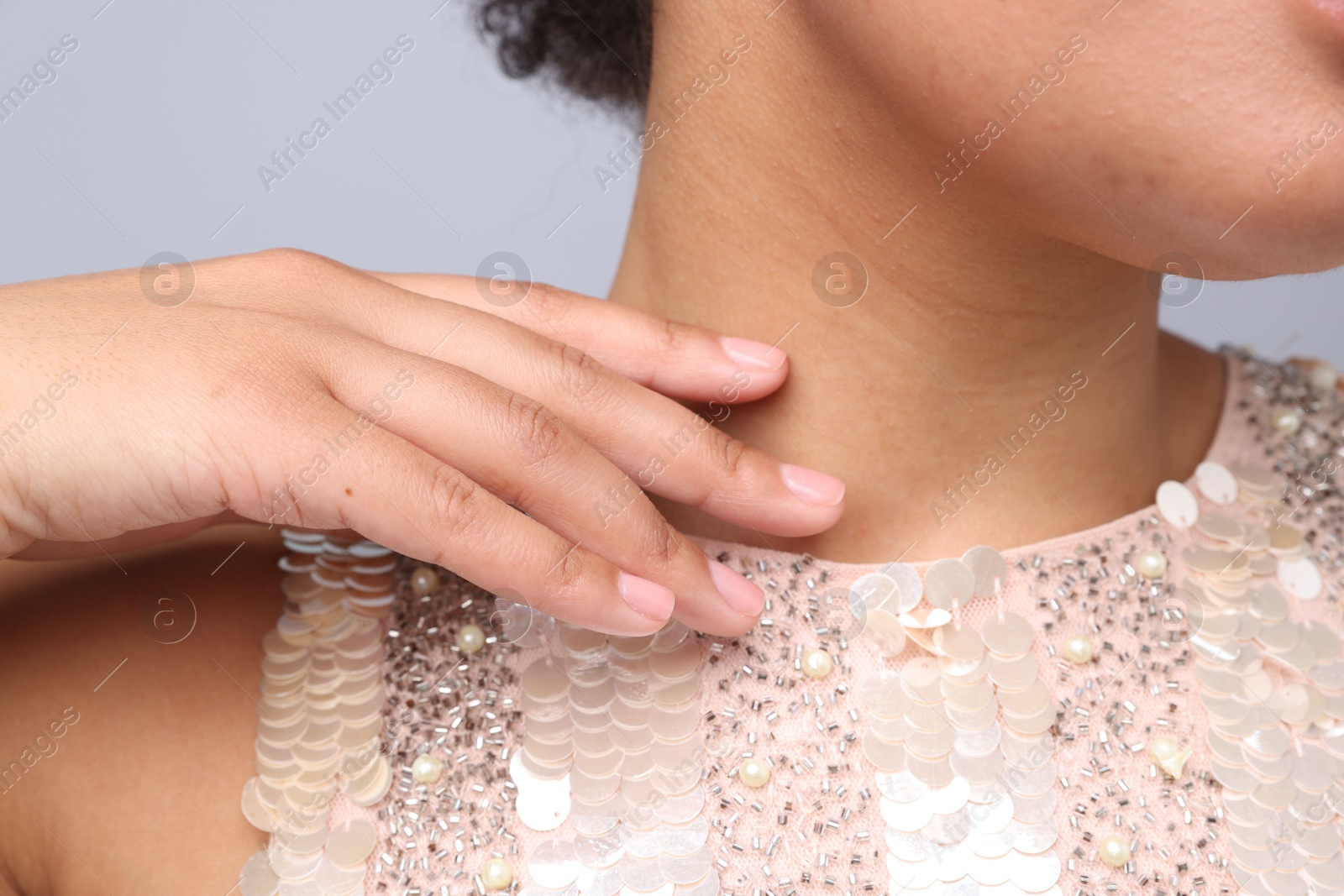 Photo of Young woman with healthy skin on light grey background, closeup