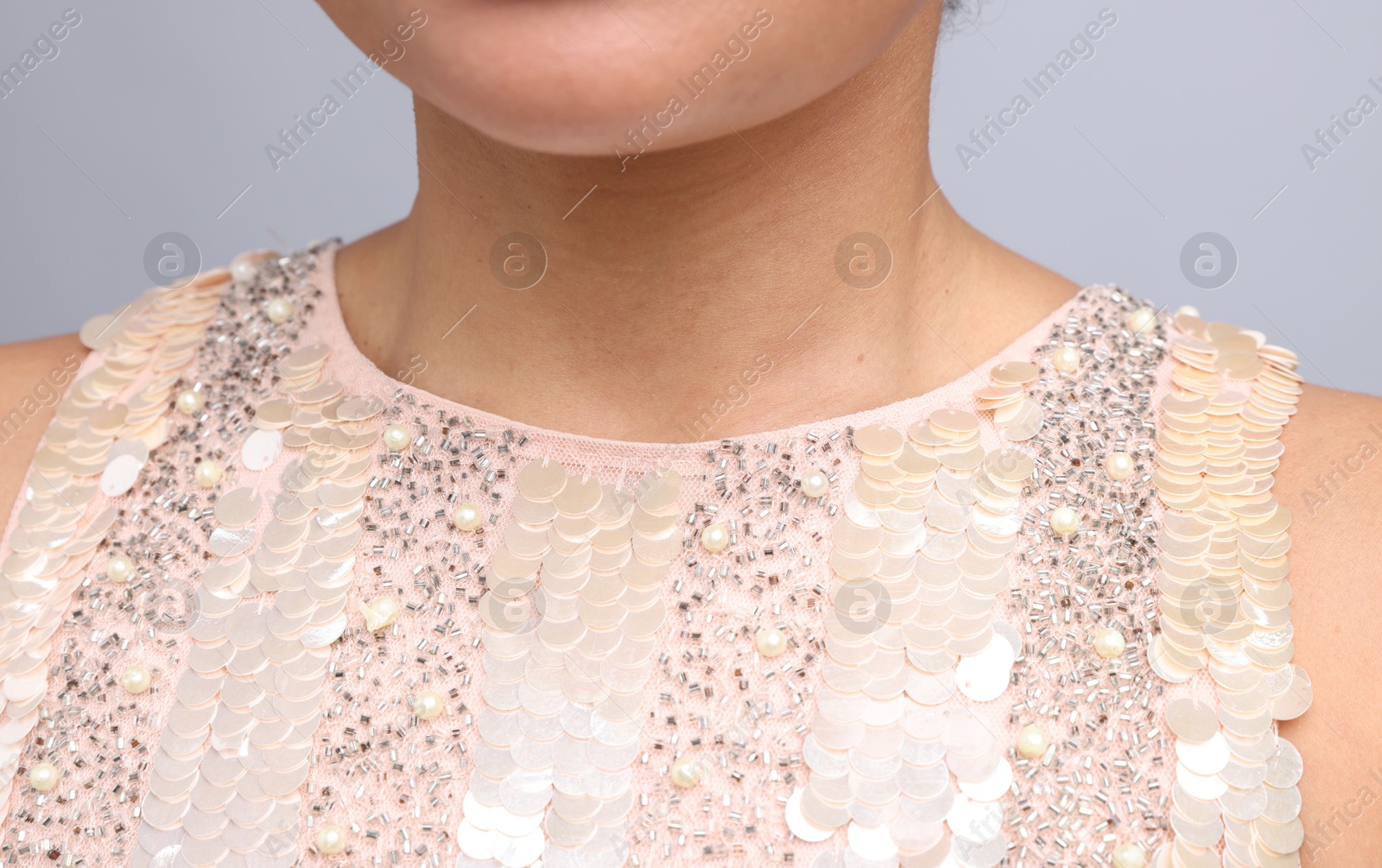 Photo of Young woman with healthy skin on light grey background, closeup