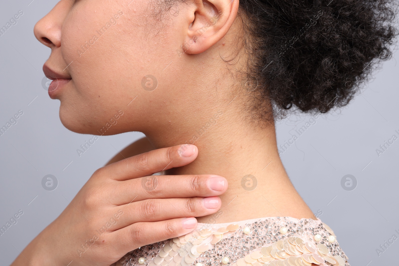Photo of Young woman with healthy skin on light grey background, closeup