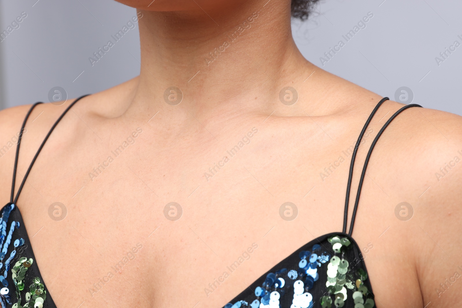 Photo of Young woman with healthy skin on light grey background, closeup