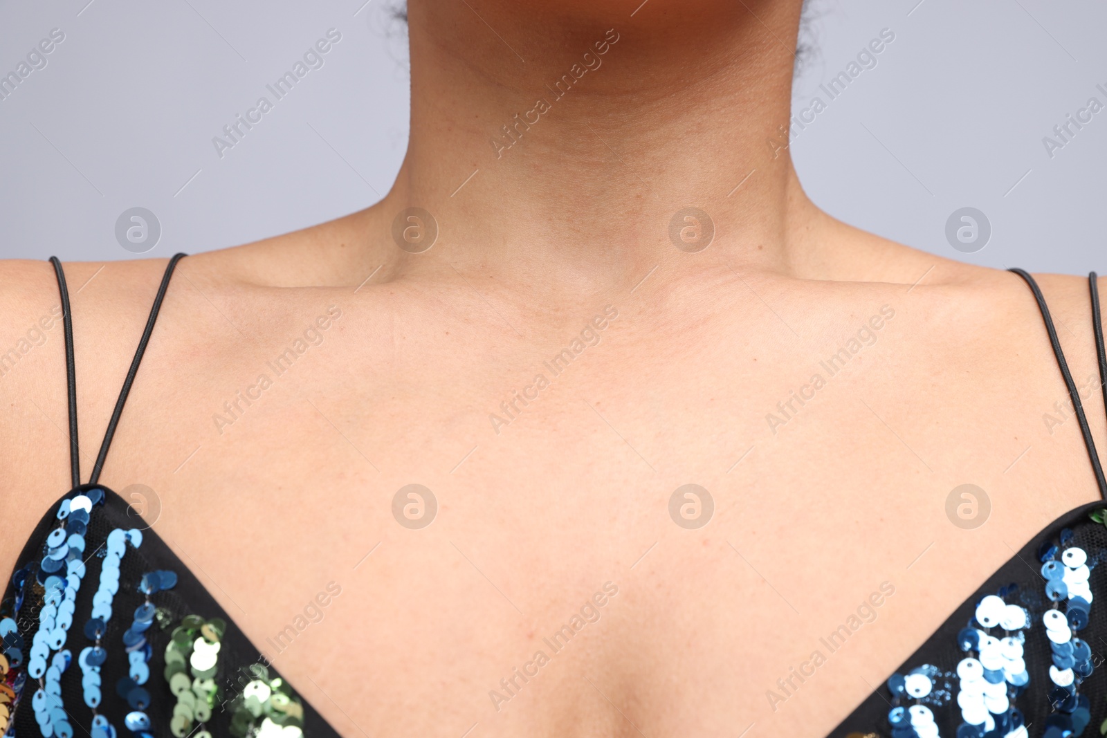 Photo of Young woman with healthy skin on light grey background, closeup