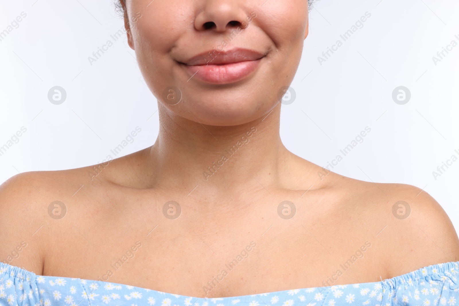 Photo of Young woman with healthy skin on white background, closeup