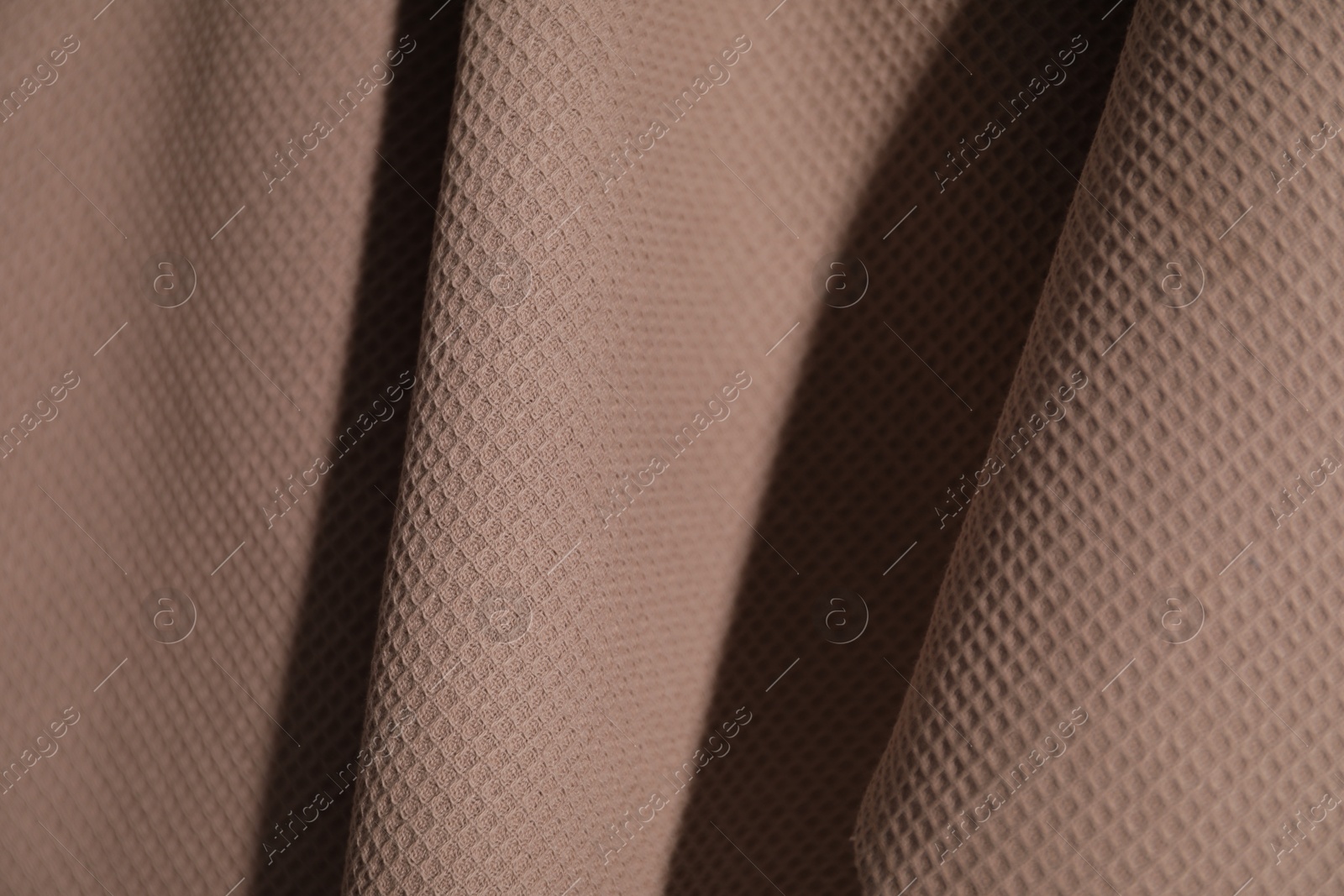 Clean brown waffle towel as background, closeup Photo of Clean brown waffle towel as background, closeup