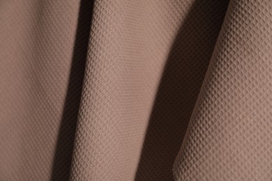 Photo of Clean brown waffle towel as background, closeup