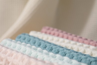Photo of Texture of stacked waffle towels as background, closeup