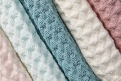Photo of Texture of stacked waffle towels as background, top view