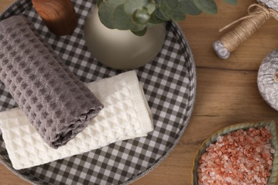 Photo of Flat lay composition with waffle towels on wooden table