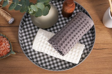 Photo of Flat lay composition with waffle towels on wooden table