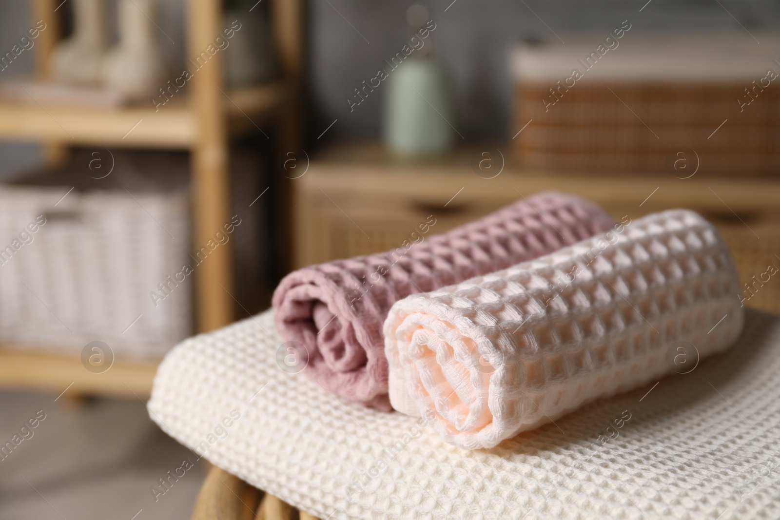 Clean waffle towels on chair in bathroom, closeup Photo of Clean waffle towels on chair in bathroom, closeup
