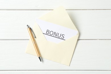 Photo of Envelope, card with word Bonus and pen on white wooden table, top view
