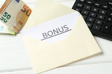 Photo of Envelope, card with word Bonus, calculator and euro banknotes on white wooden table, above view