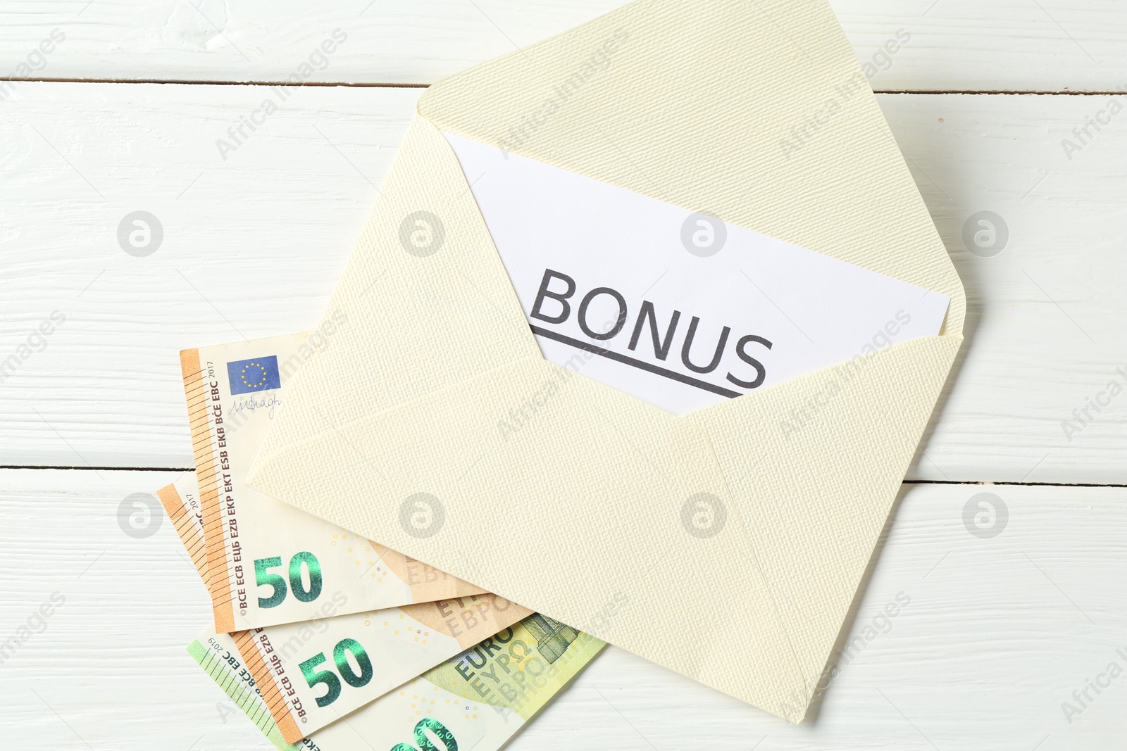 Envelope, card with word Bonus and euro banknotes on white wooden table, flat lay Photo of Envelope, card with word Bonus and euro banknotes on white wooden table, flat lay