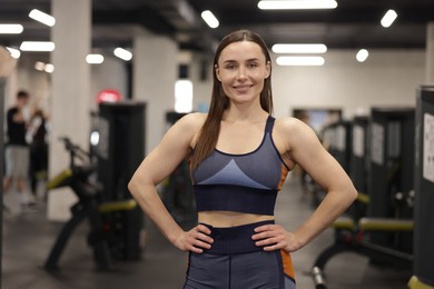Photo of Portrait of professional personal trainer in gym