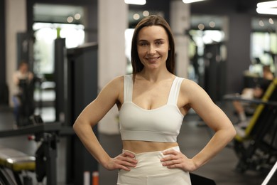 Photo of Portrait of professional personal trainer in gym