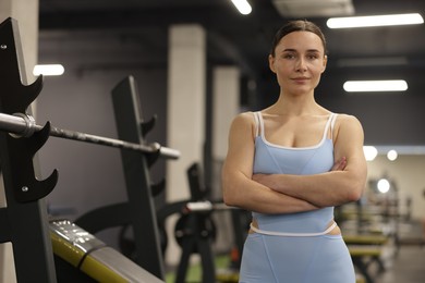Photo of Portrait of professional personal trainer in gym
