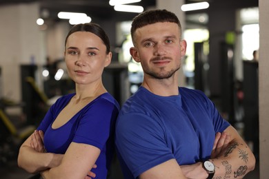 Photo of Portrait of professional personal trainers in gym