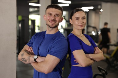 Photo of Portrait of professional personal trainers in gym