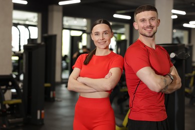 Photo of Portrait of professional personal trainers in gym