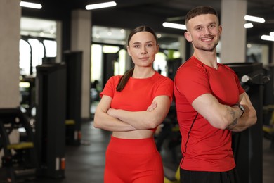 Photo of Portrait of professional personal trainers in gym