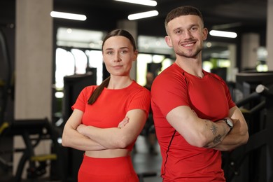 Photo of Portrait of professional personal trainers in gym