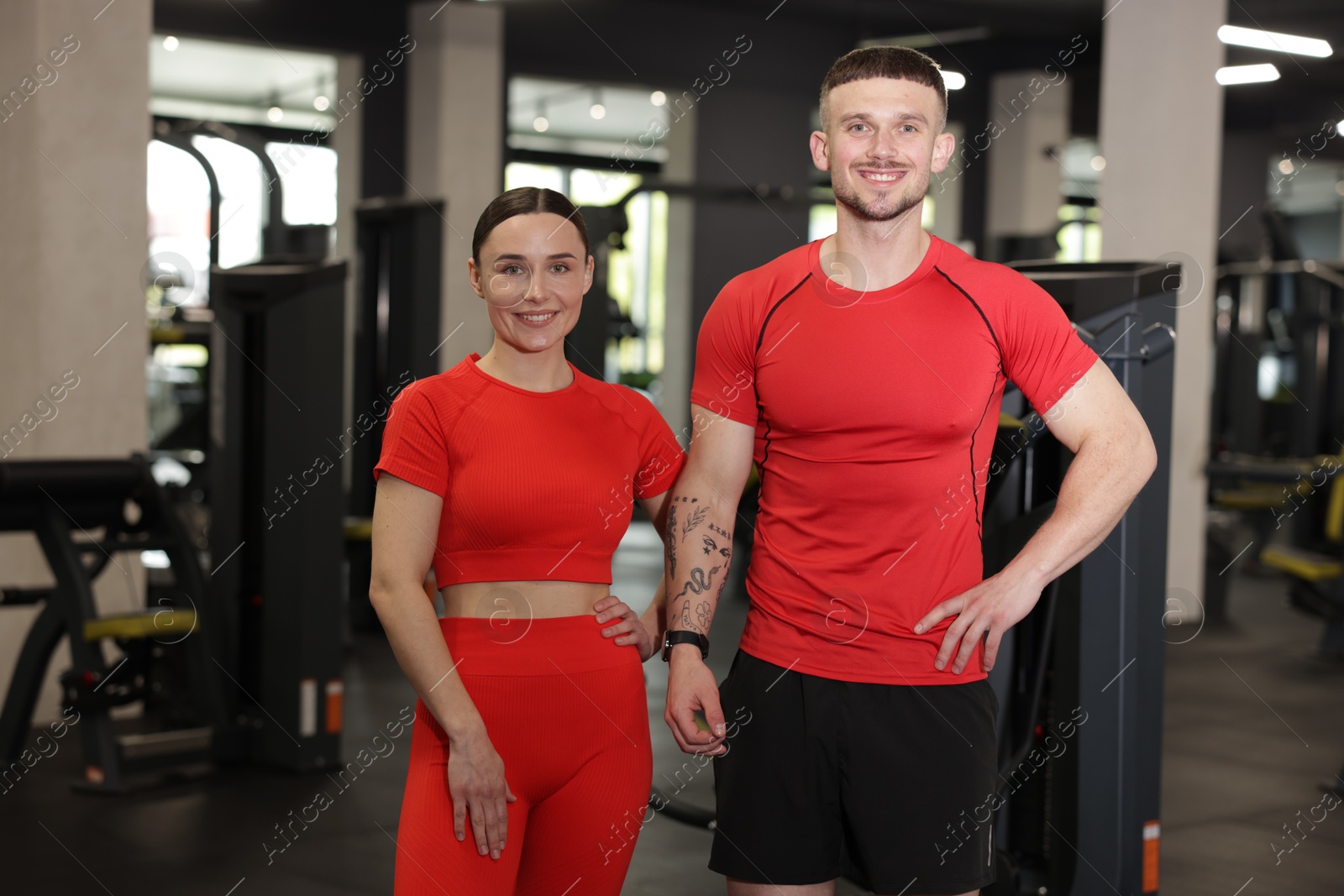 Photo of Portrait of professional personal trainers in gym