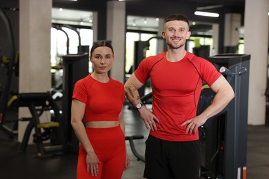 Photo of Portrait of professional personal trainers in gym