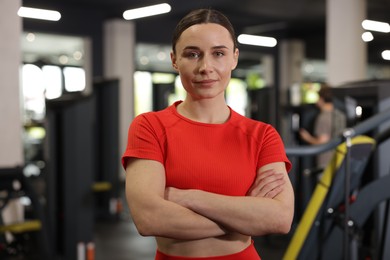 Photo of Portrait of professional personal trainer in gym