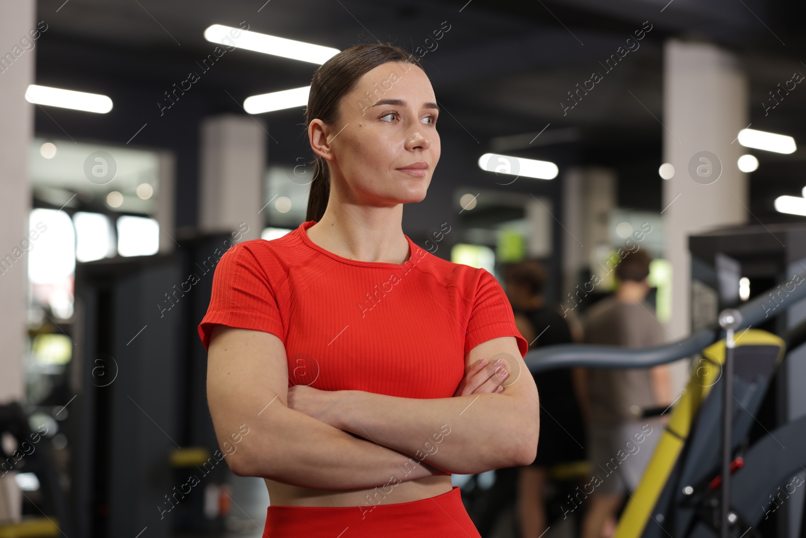 Photo of Portrait of professional personal trainer in gym
