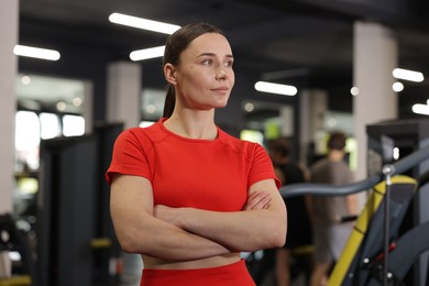 Photo of Portrait of professional personal trainer in gym