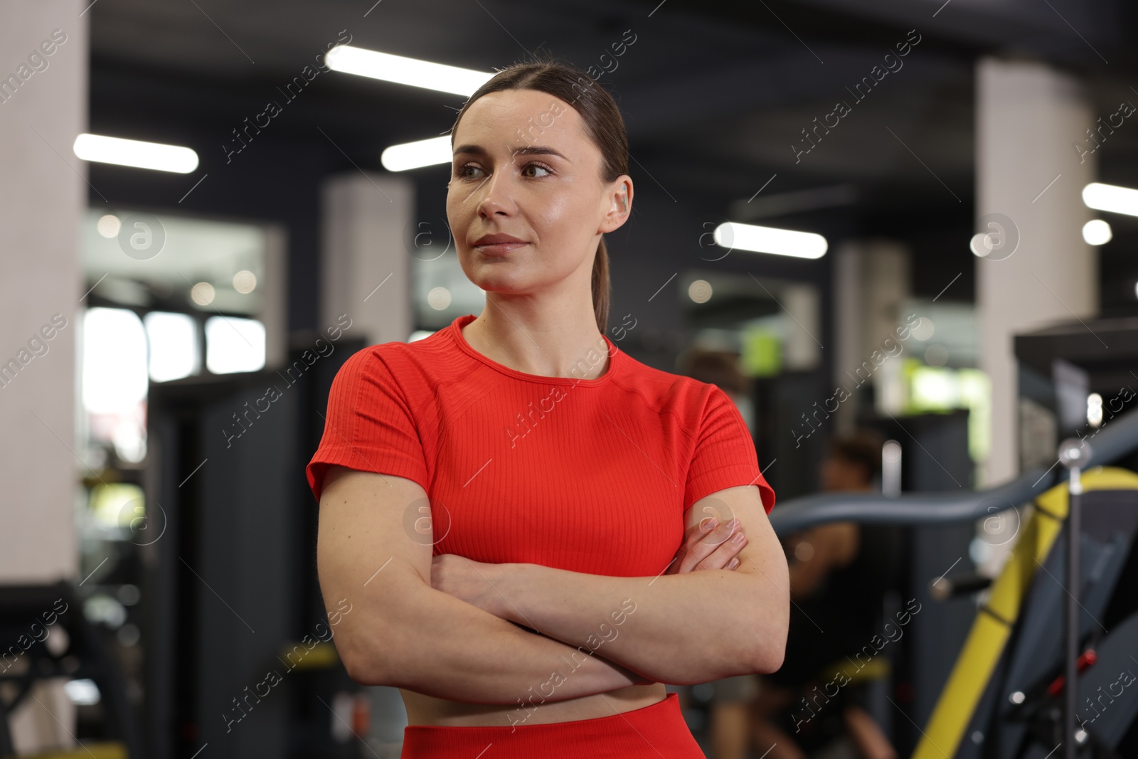 Photo of Portrait of professional personal trainer in gym