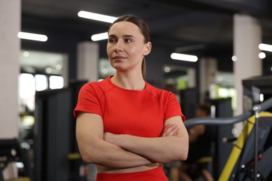 Photo of Portrait of professional personal trainer in gym