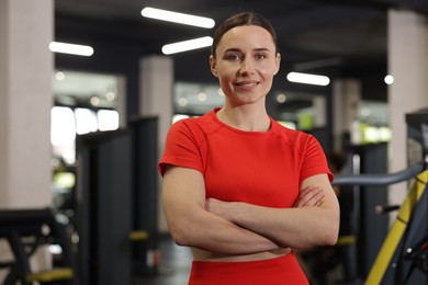 Photo of Portrait of professional personal trainer in gym