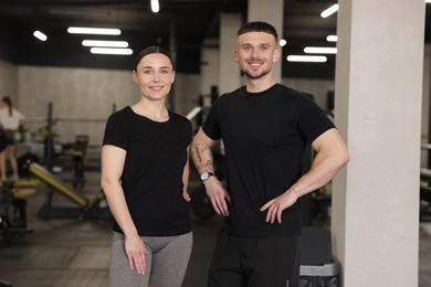 Photo of Portrait of professional personal trainers in sport center