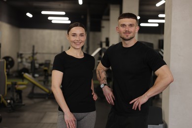Photo of Portrait of professional personal trainers in sport center