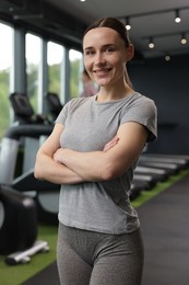 Photo of Portrait of personal trainer in sport center