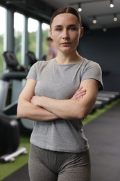 Photo of Portrait of personal trainer in sport center