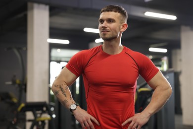 Photo of Portrait of professional personal trainer in gym