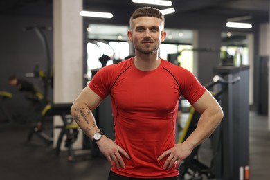 Photo of Portrait of professional personal trainer in gym