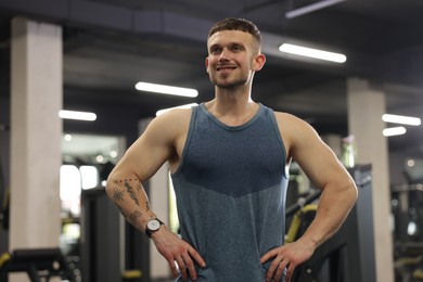 Photo of Portrait of professional personal trainer in gym
