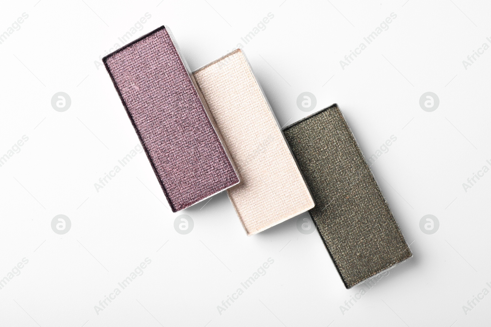 Beautiful eye shadow refill pans on white background, flat lay Photo of Beautiful eye shadow refill pans on white background, flat lay