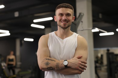 Photo of Portrait of professional personal trainer in gym