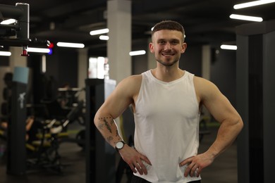 Photo of Portrait of professional personal trainer in gym