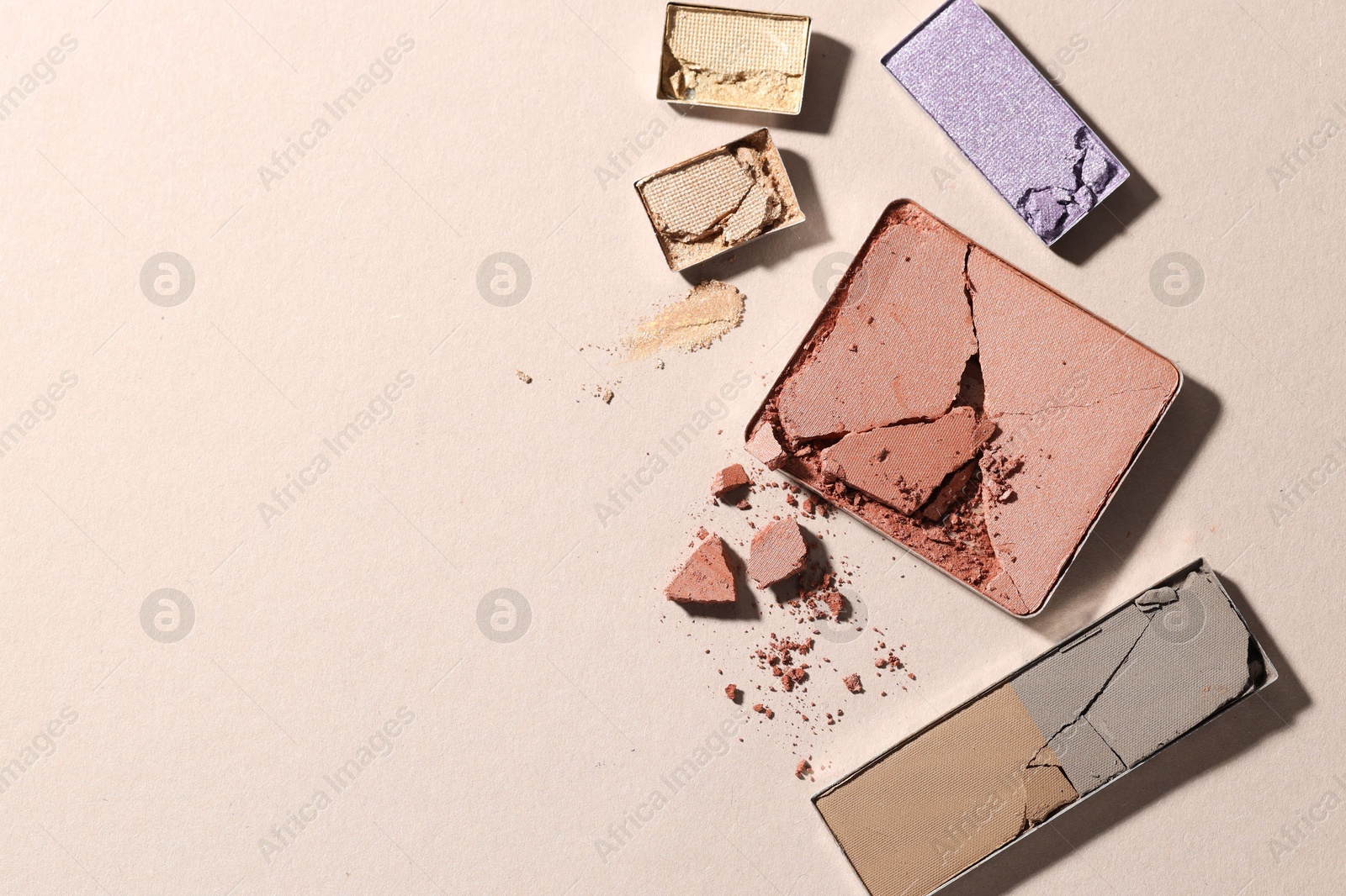 Beautiful eyeshadow refill pans on beige background, flat lay. Space for text Photo of Beautiful eyeshadow refill pans on beige background, flat lay. Space for text