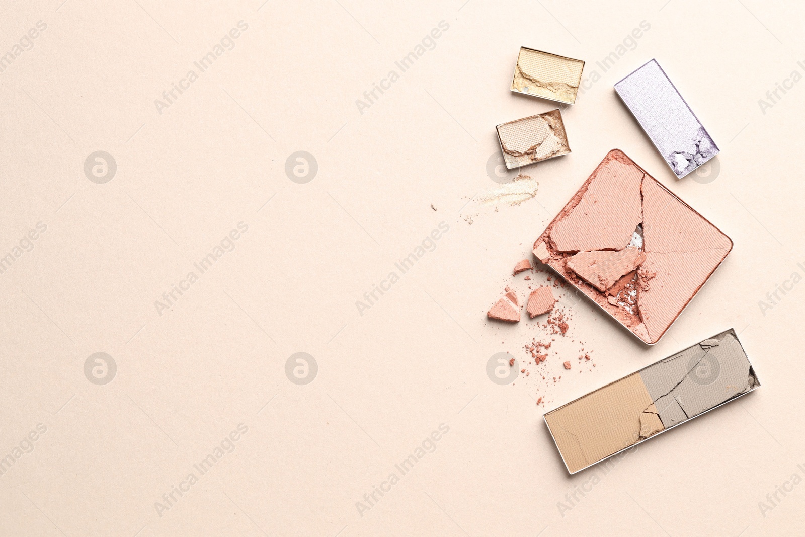 Beautiful eyeshadow refill pans on beige background, flat lay. Space for text Photo of Beautiful eyeshadow refill pans on beige background, flat lay. Space for text
