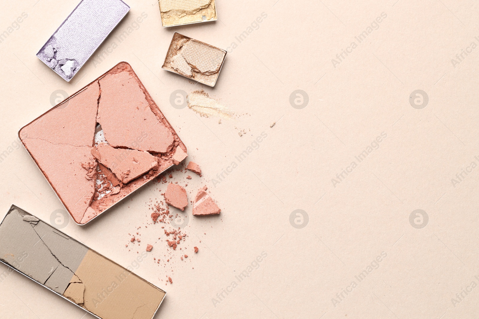 Beautiful eyeshadow refill pans on beige background, flat lay. Space for text Photo of Beautiful eyeshadow refill pans on beige background, flat lay. Space for text