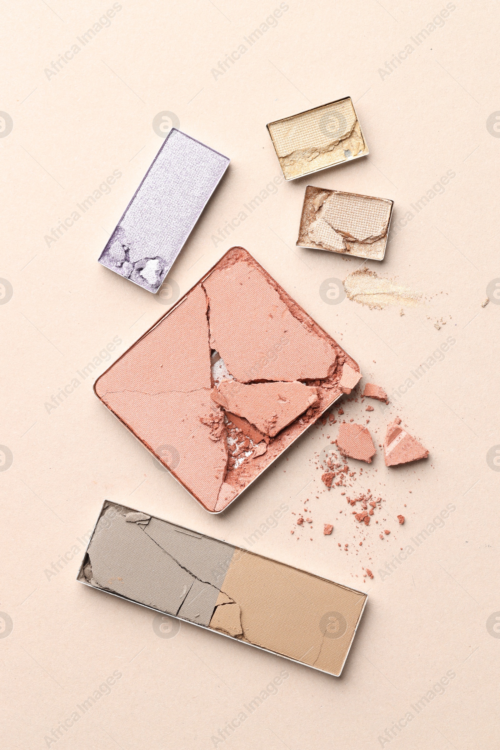 Beautiful eyeshadow refill pans on beige background, flat lay Photo of Beautiful eyeshadow refill pans on beige background, flat lay