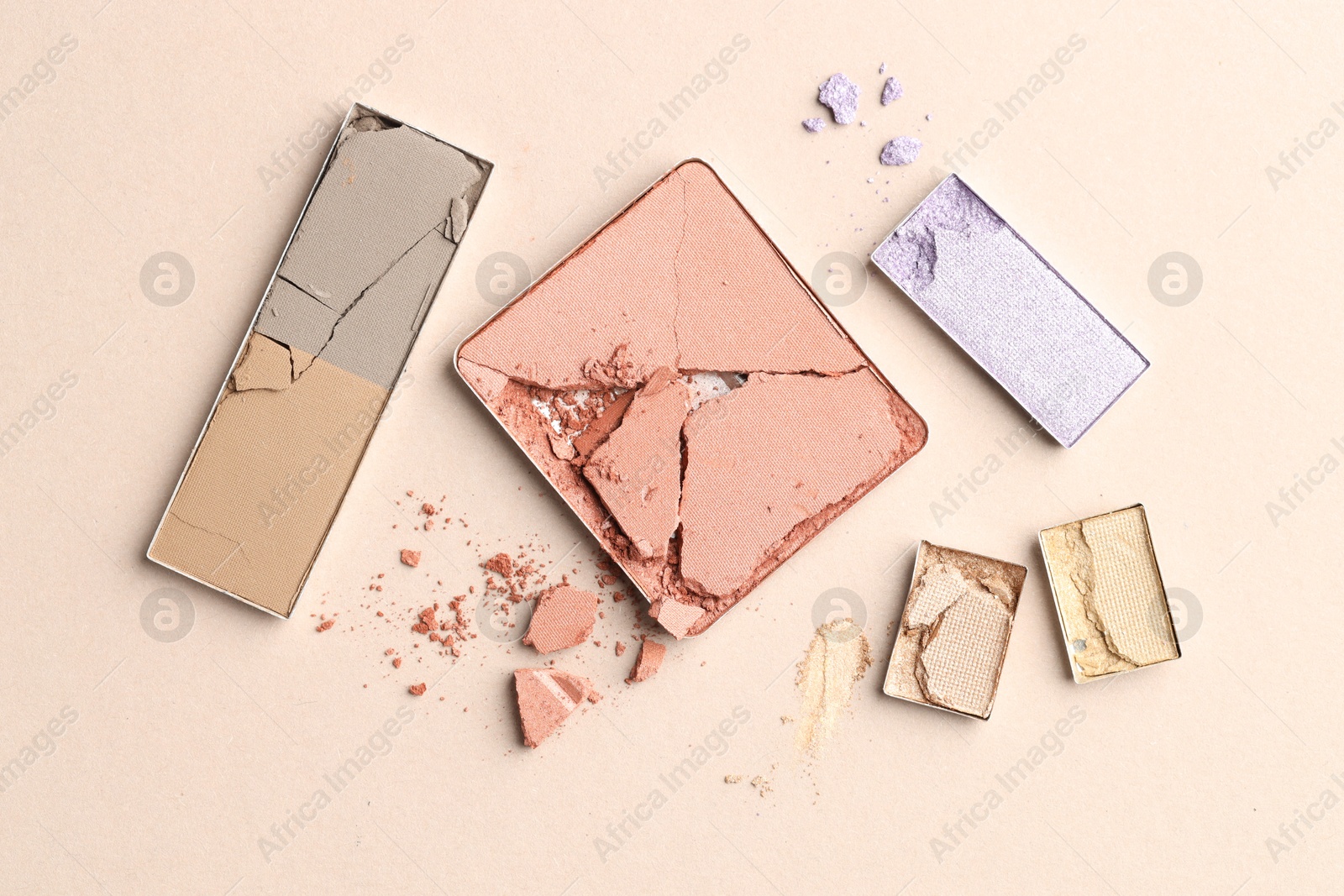 Beautiful eyeshadow refill pans on beige background, flat lay Photo of Beautiful eyeshadow refill pans on beige background, flat lay
