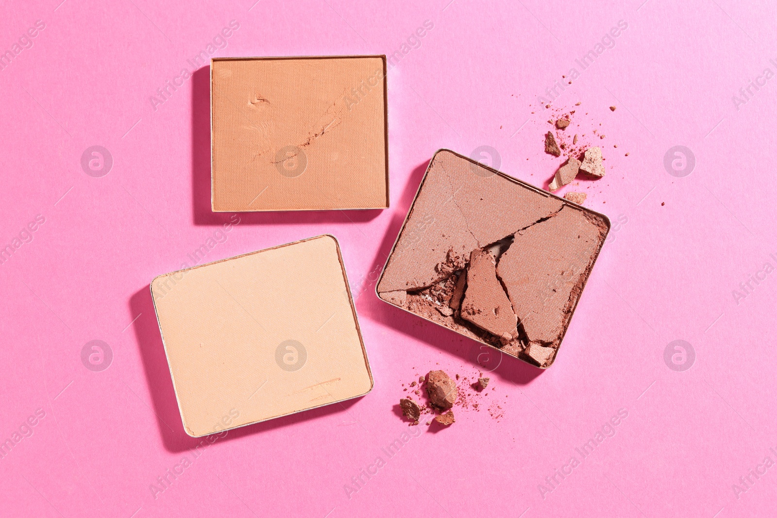 Refill pans of cosmetic products on pink background, flat lay Photo of Refill pans of cosmetic products on pink background, flat lay