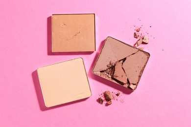 Photo of Refill pans of cosmetic products on pink background, flat lay
