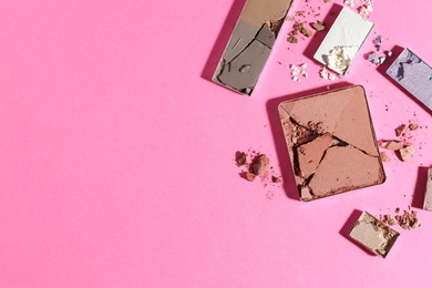 Photo of Beautiful eyeshadow refill pans on pink background, flat lay. Space for text